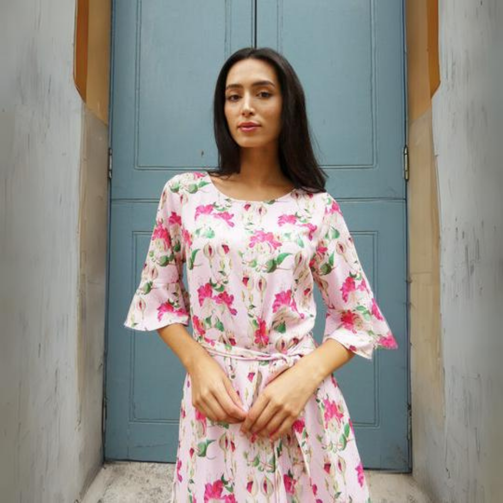 This beautiful pink floral midi dress features a detachable tie belt around the waist and mid length sleeves.