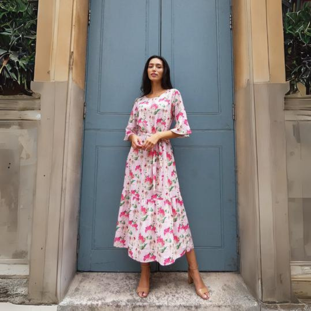 This beautiful pink floral midi dress features a detachable tie belt around the waist and mid length sleeves.