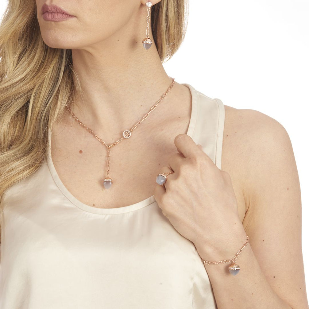 Elegant rose gold plated bracelet with a pyramid-shaped gray agate crystal pendant and sparkling cubic zirconia diamond-cut links. Shop premium jewelry online.