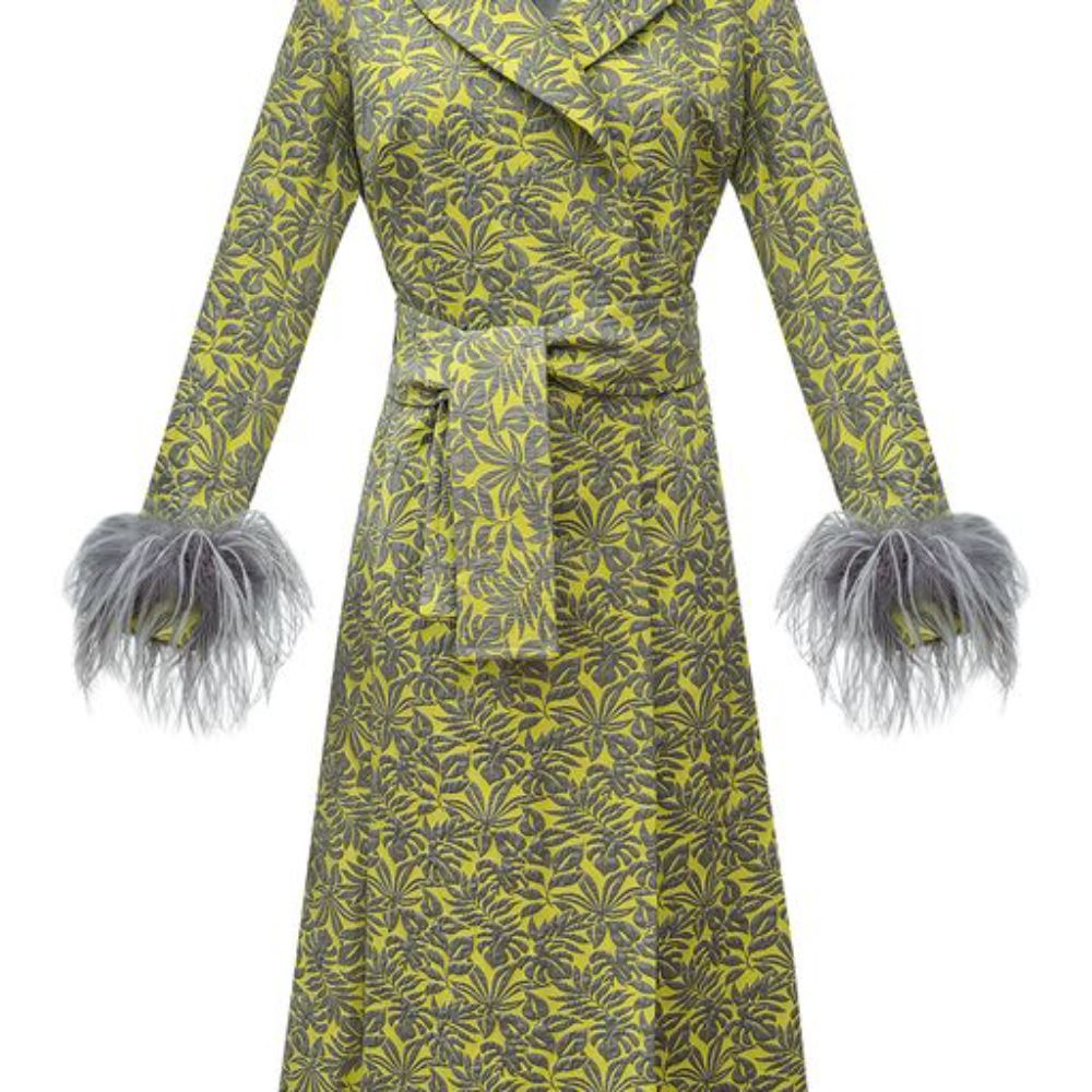 Signature Coat With Detachable Feather Cuffs has printed fabric with an epaulette details. 