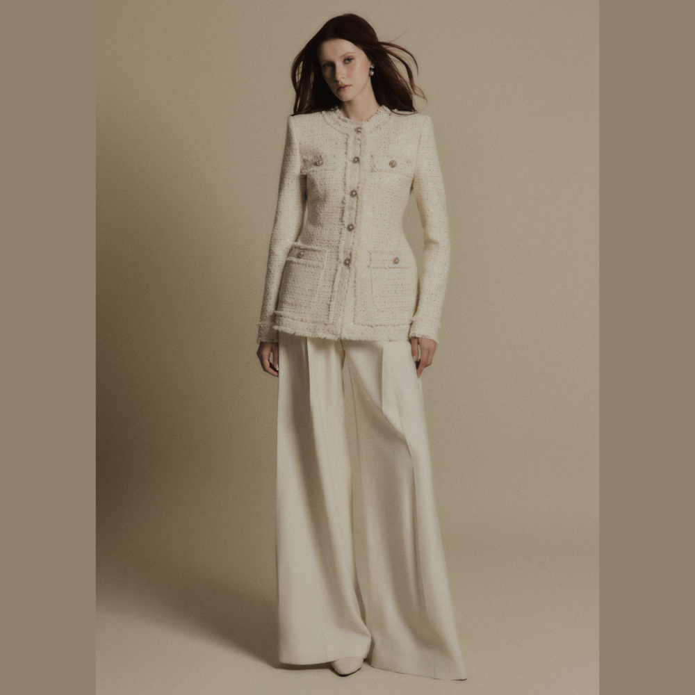 Create a polished look by styling a luxe dress with the elegant Ivory Crest Tweed Jacket. Shop Now!