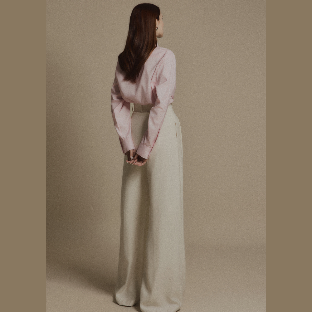 Experience modern luxury clothing paired seamlessly with sophisticated Ivory Drift Pants. Shop Now!