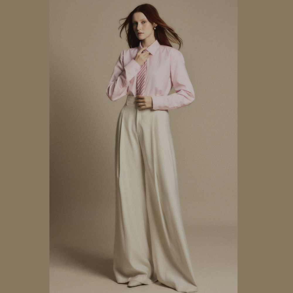 Experience modern luxury clothing paired seamlessly with sophisticated Ivory Drift Pants. Shop Now!