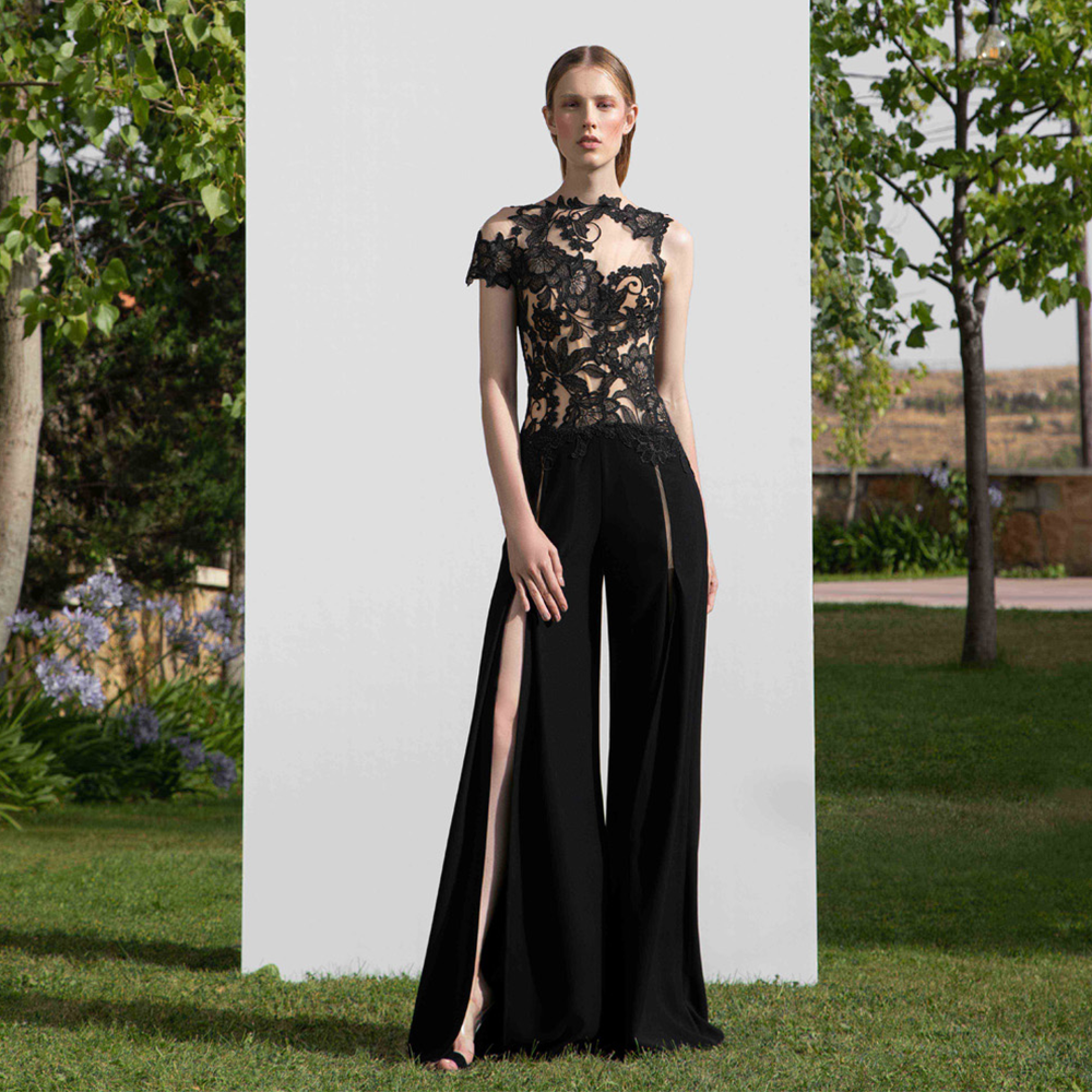 Jumpsuit joining floral laced asymmetrical top with palazo crepe wide leg pants.