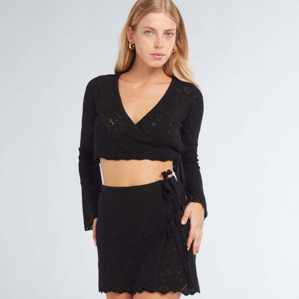 Luxury clothing store offers Kaia Black Top for graceful dressing. Shop Now!