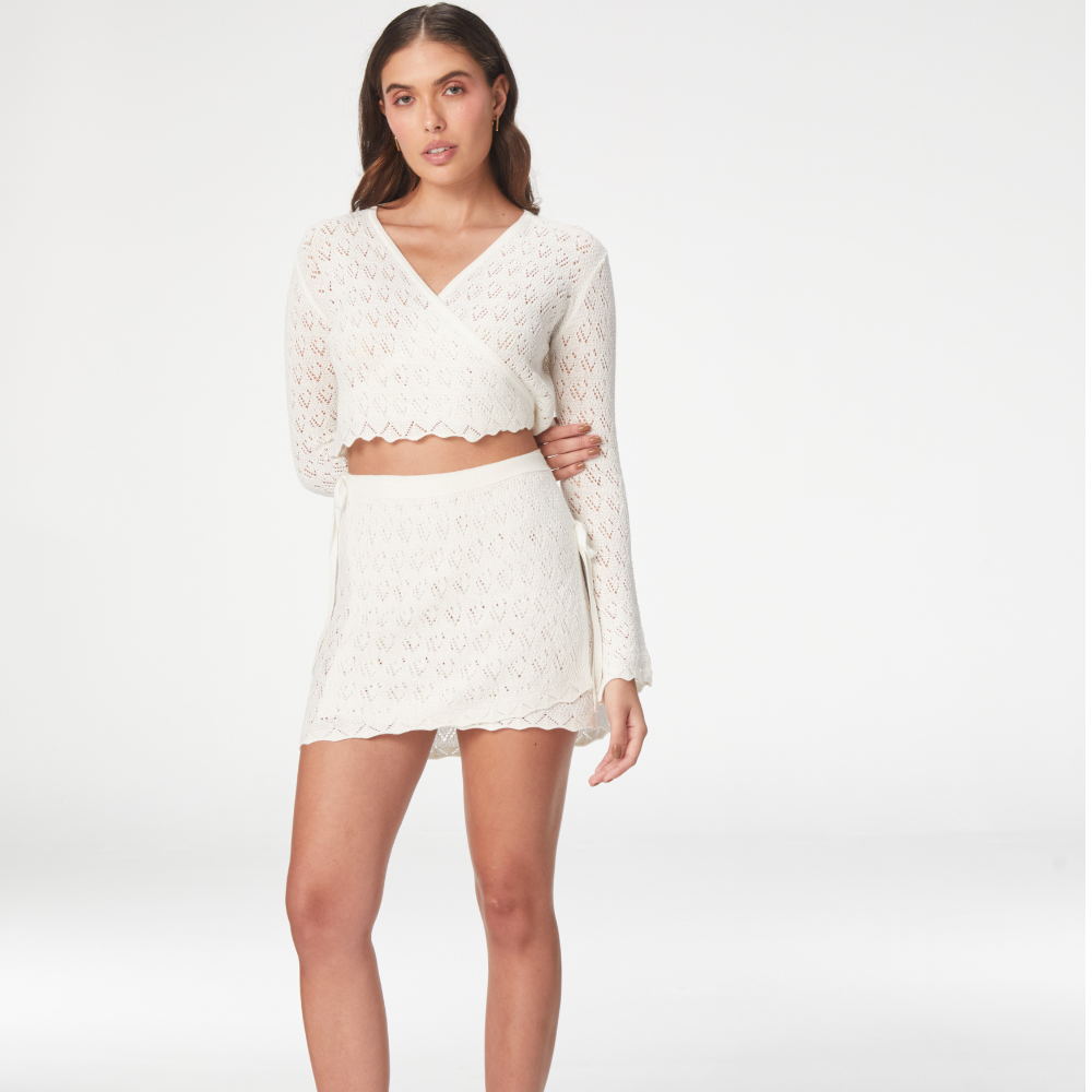 The Kaia Ivory Top from our dress store brings style and comfort together. Shop Now!