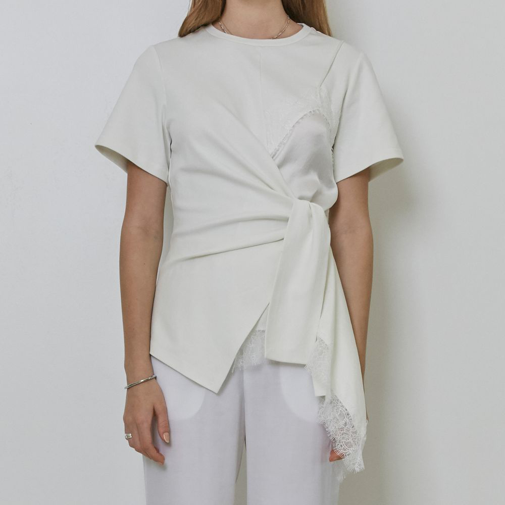 Raw-edged, Round neckline One side handkerchief-hem with patch pocket Adjustable tie belt at waist Relaxed silhouette.