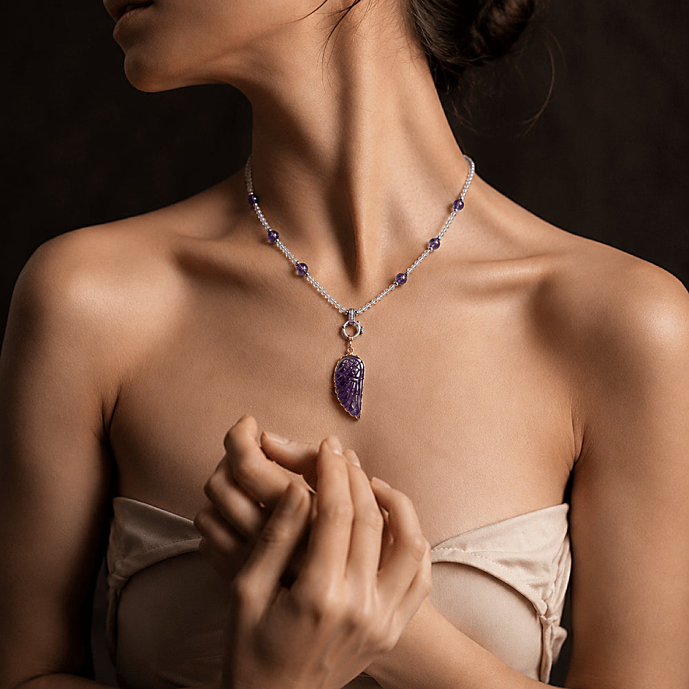 Discover the Lilith Amethyst Wing Necklace at The Luxe Maison, featuring rich violet amethyst beads and a sculptural amethyst wing pendant for an elegant, mystical touch inspired by freedom and transformation.