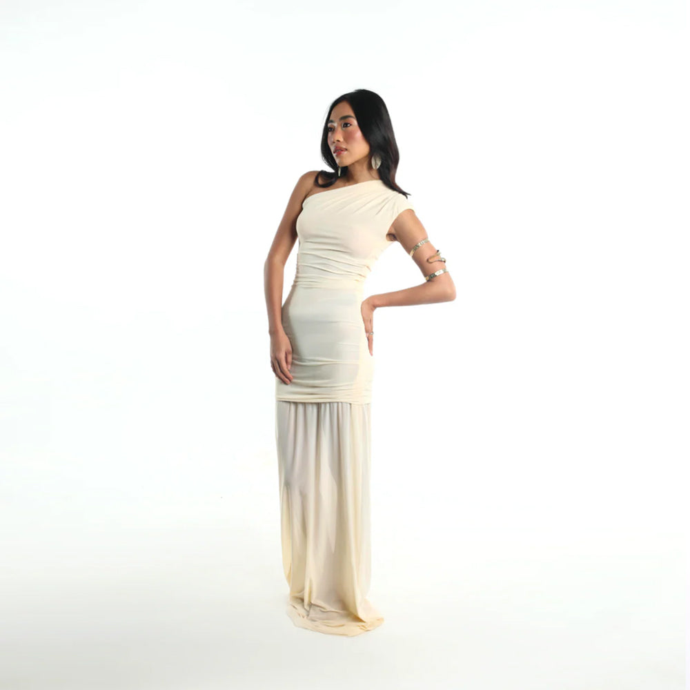 Ivory jersey dress with asymmetrical fit and gathered waist, perfect for events. Shop online from our curated edit of premium fashion.