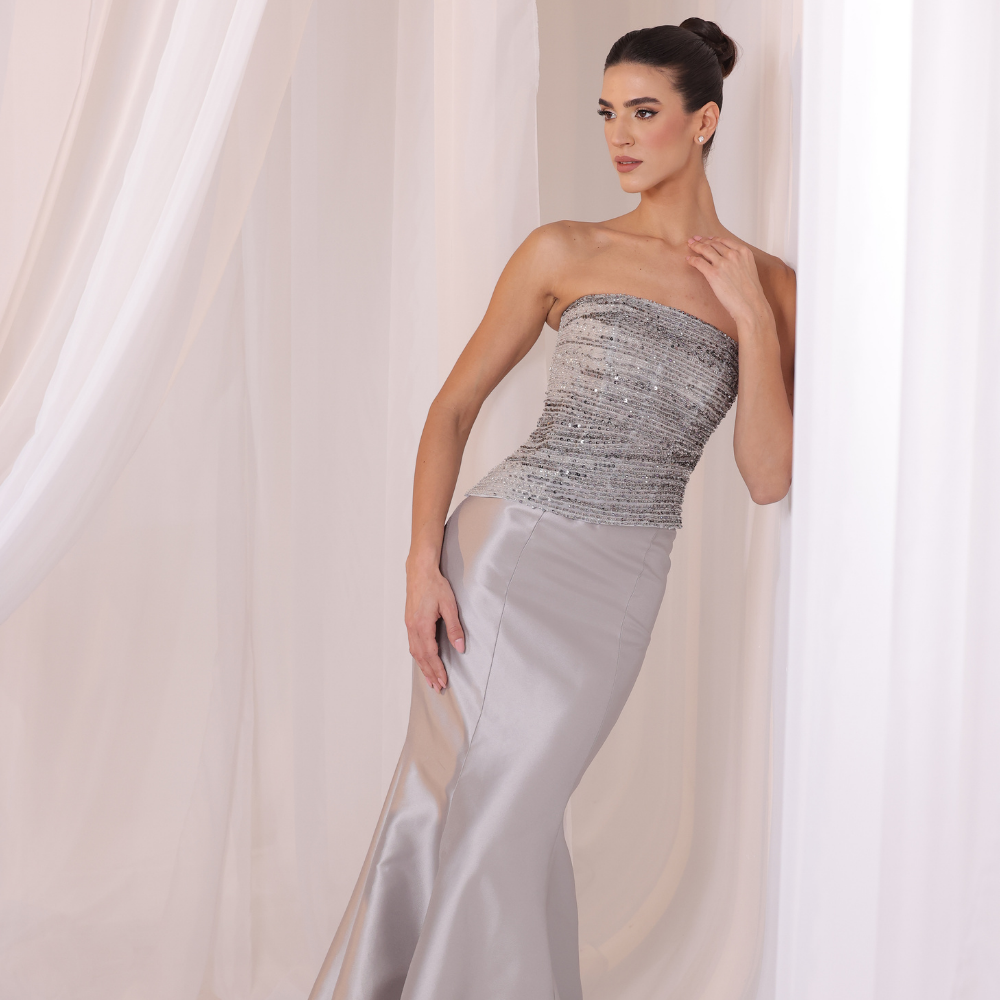 Shop online elegant gown with textured strapless bodice, subtle shimmer and smooth satin skirt, perfect for parties and special occasions.