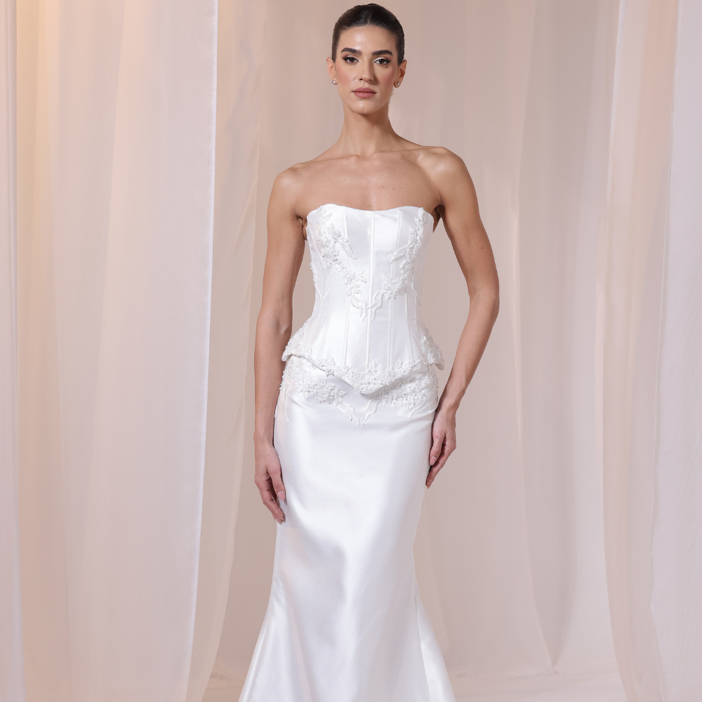 Shop online refined ivory gown with structured lace corset bodice and smooth satin silhouette, perfect for weddings, parties and special occasions.