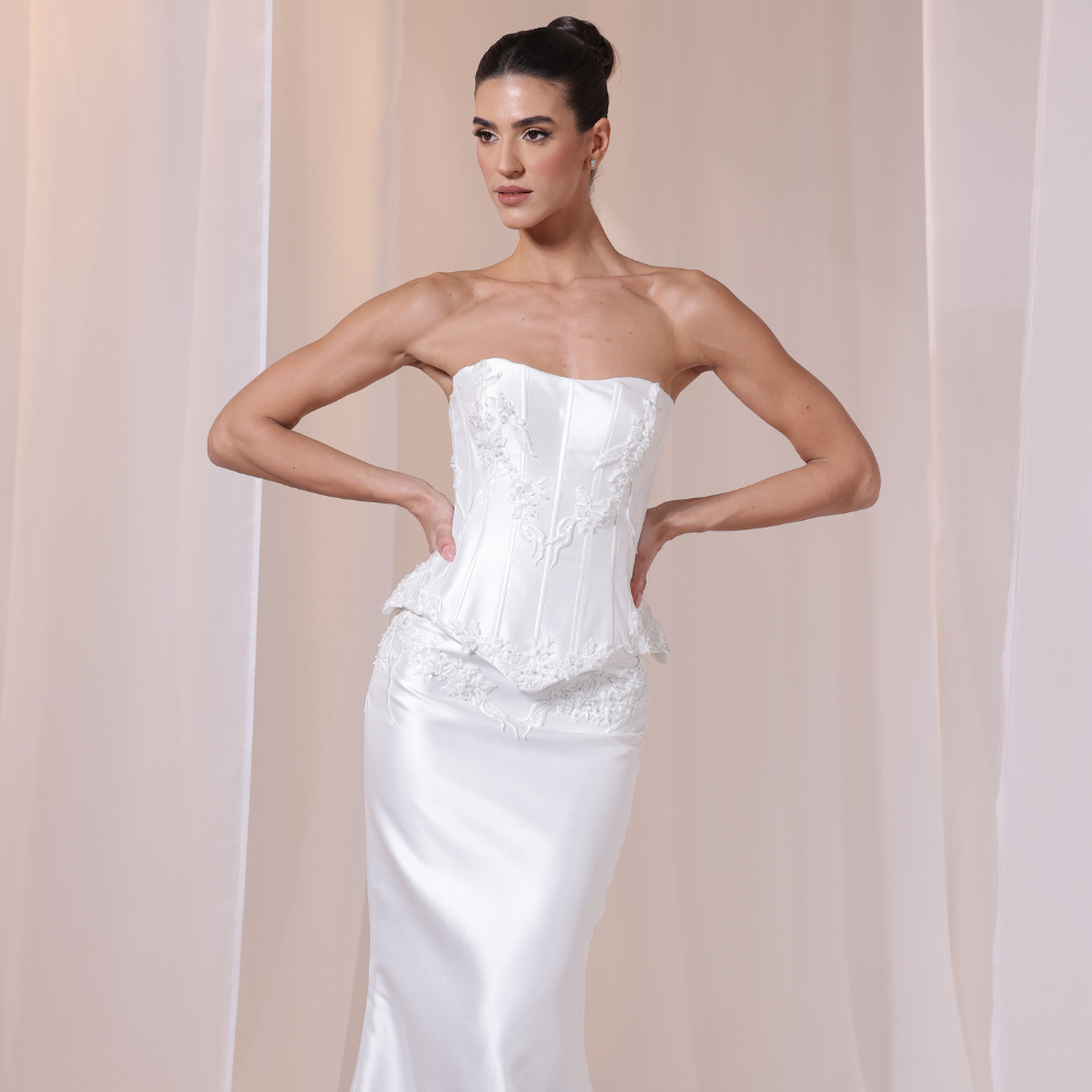 Shop online refined ivory gown with structured lace corset bodice and smooth satin silhouette, perfect for weddings, parties and special occasions.