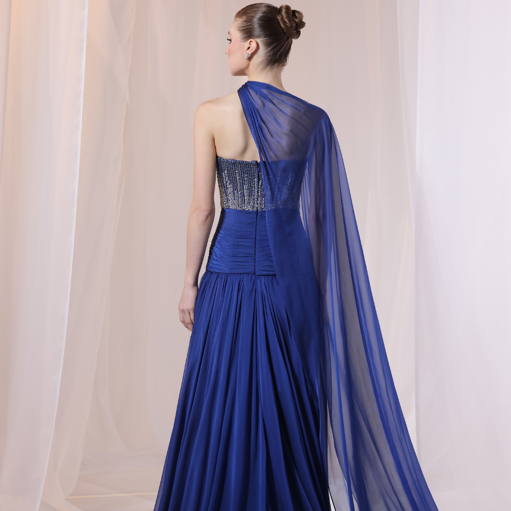 Shop online soft yellow gown with draped bodice, asymmetrical off-shoulder detail and embellished airy layers, perfect for special occasions.