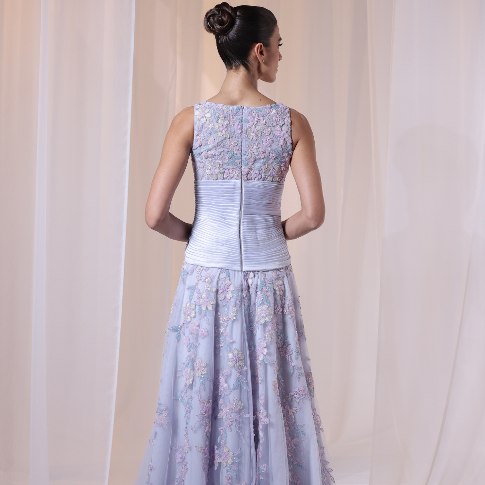 Shop online soft lavender gown with delicate floral embroidery and flowing layered silhouette, perfect for parties, receptions and special occasions.