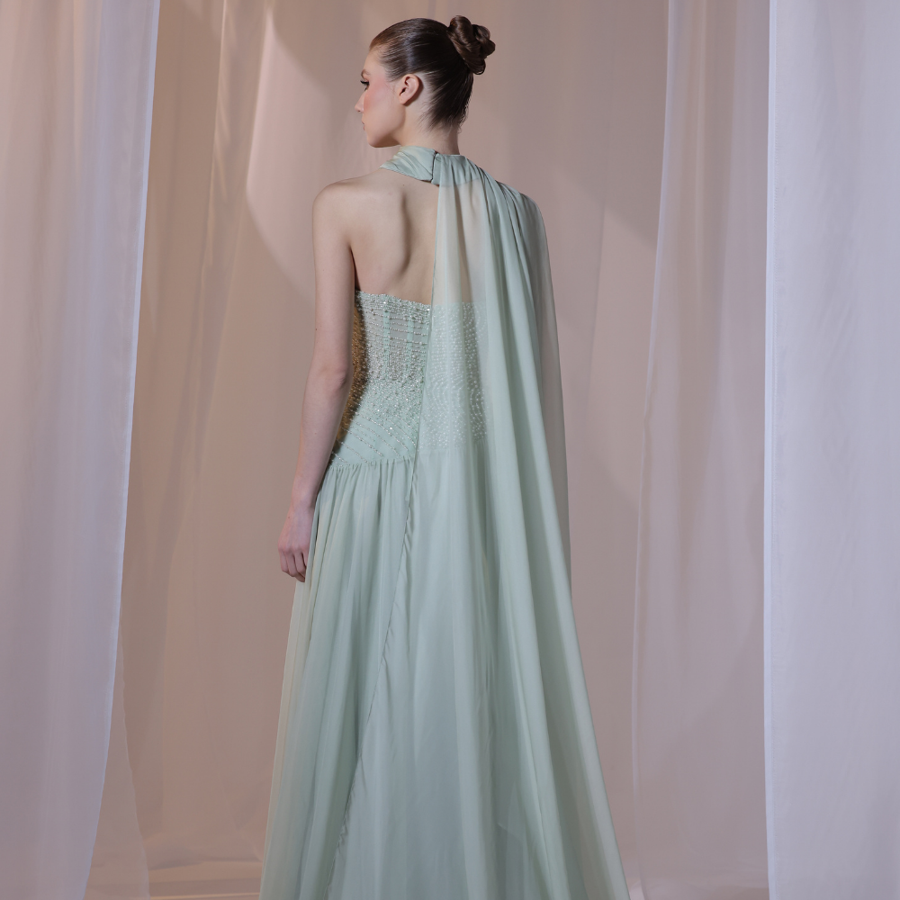 Shop online soft mint gown with shimmering beadwork, sheer draped scarf and flowing silhouette, perfect for parties, receptions and special occasions.