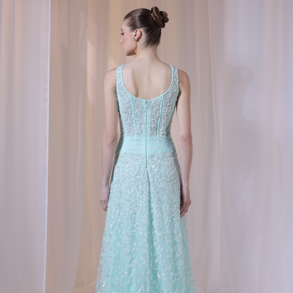Shop online soft mint gown with structured pleated bodice, delicate shimmer details and flowing embellished skirt, perfect for parties and special occasions.