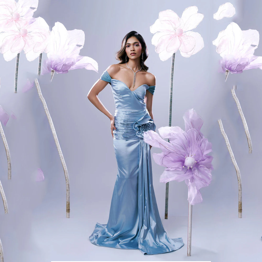 Light blue off shoulder gown with sweetheart neck and ruched fit, perfect for events. Shop online from our exclusive collection of premium styles.