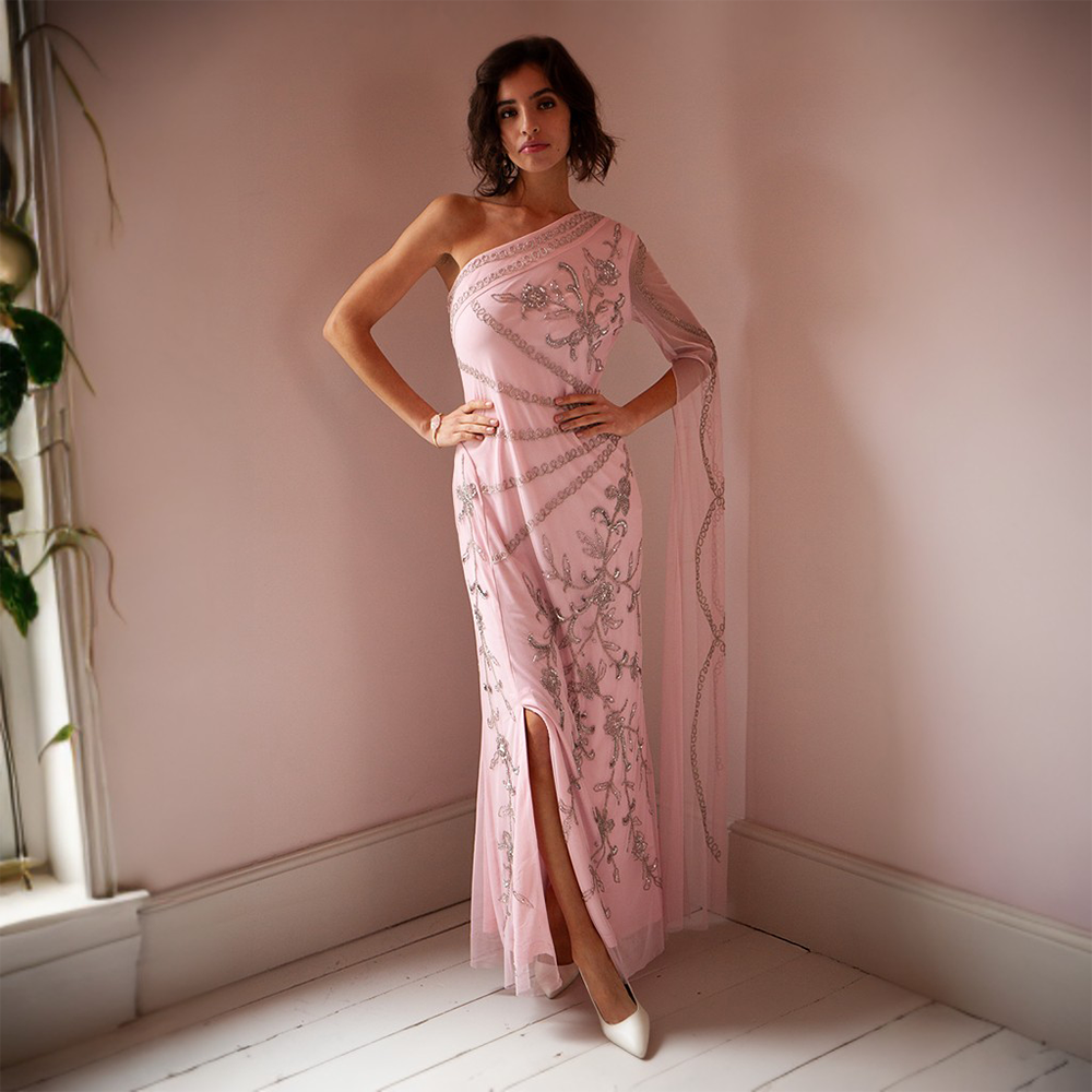 Our stunning pink maxi gown! Made with high-quality polyester, this lightweight dress features delicate beading