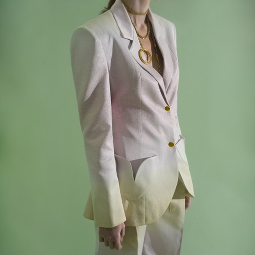 Long chain necklace with oversized ring.