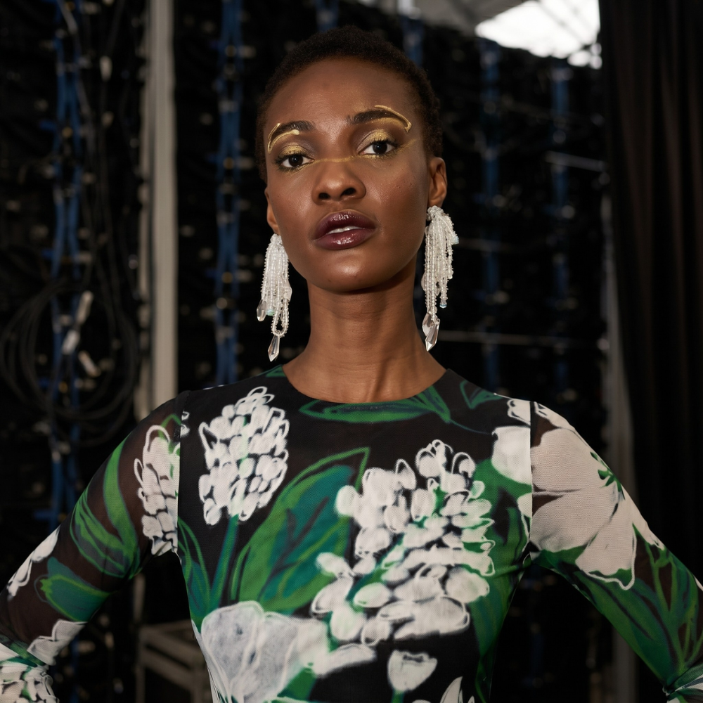 Chic floral midi dress in recycled mesh with nature-inspired print. Elegant, sustainable style. Shop premium styles online.