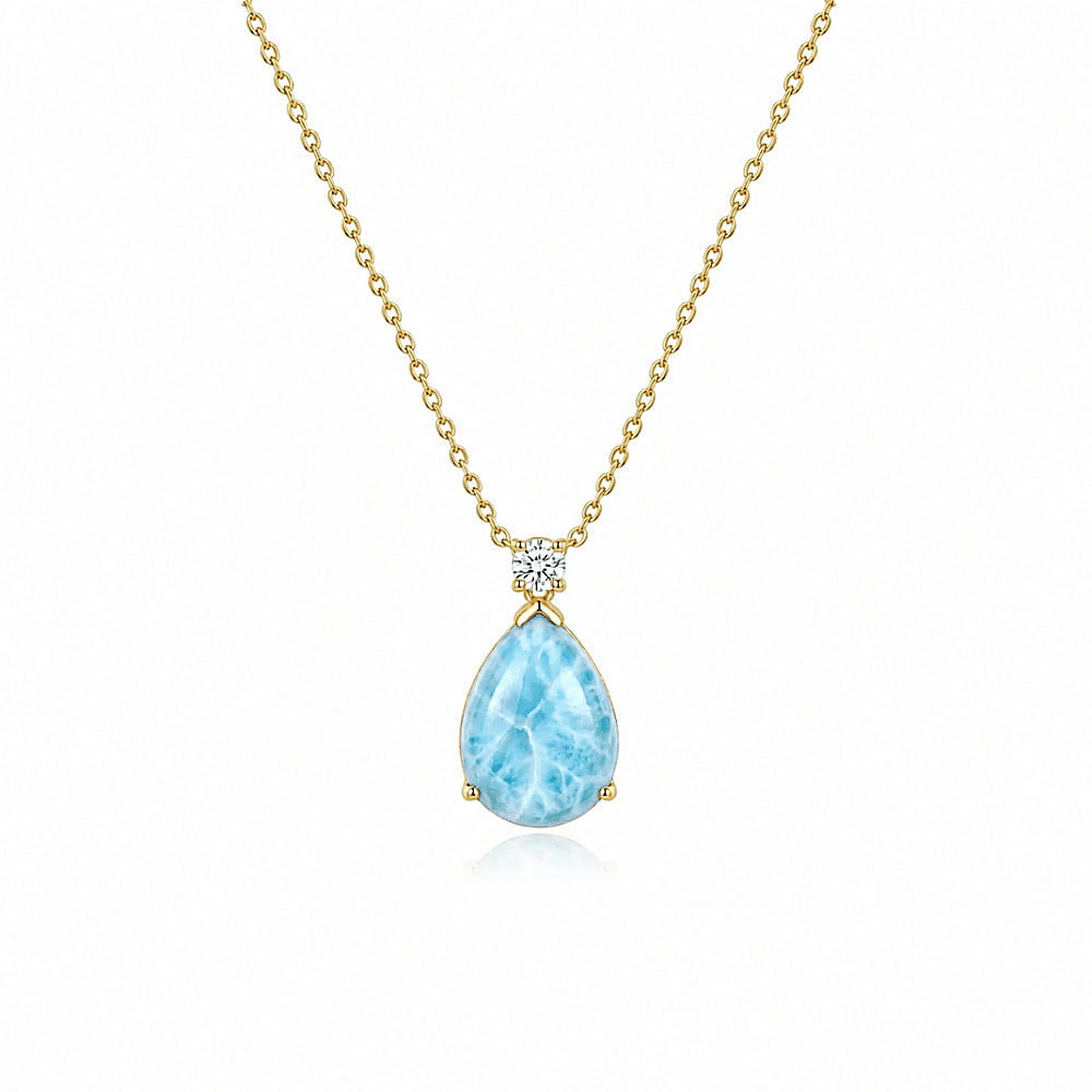 Discover the Mermaid’s Tear Larimar Necklace at The Luxe Maison, featuring naturally unique blue larimar stones inspired by the beauty and serenity of tropical oceans.