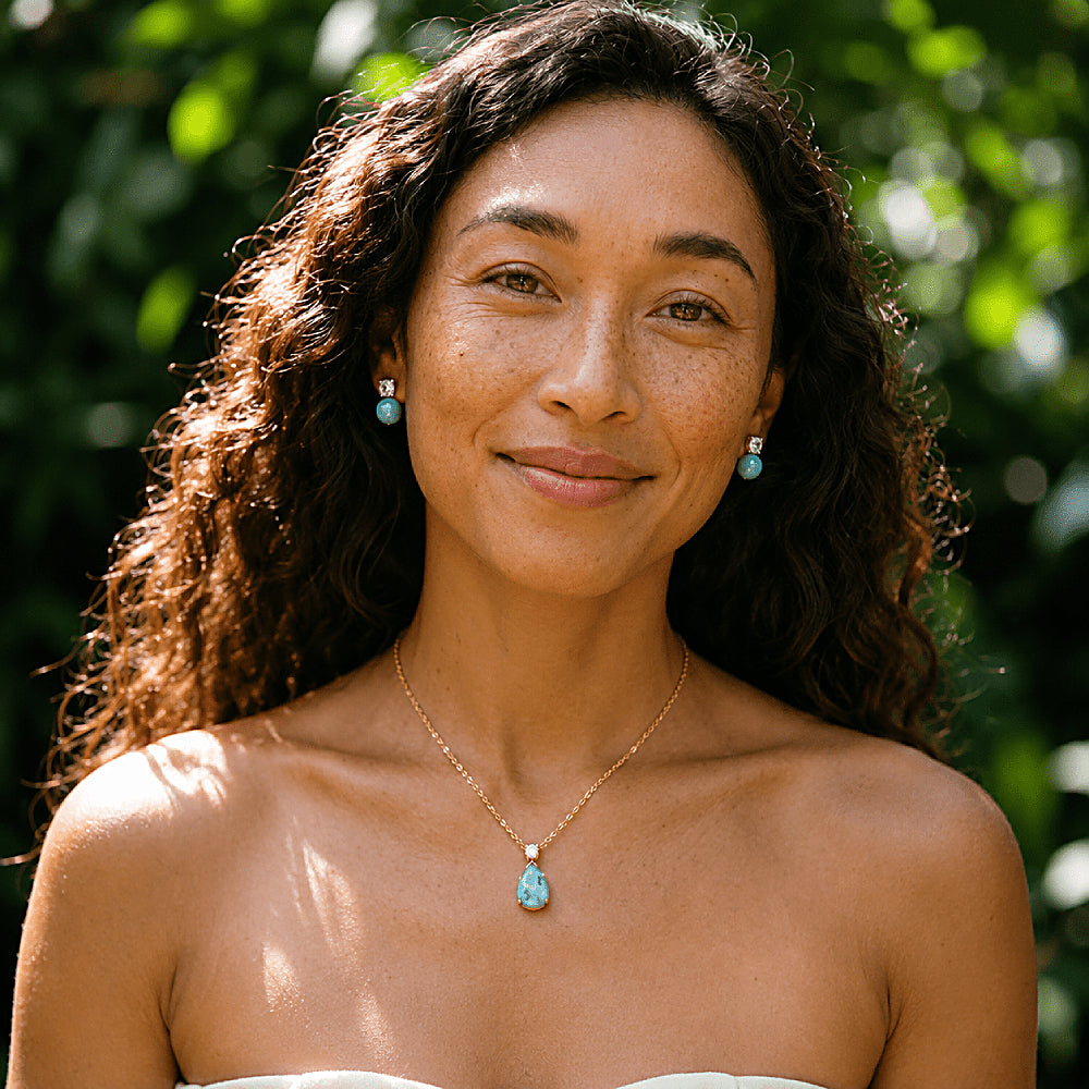 Discover the Mermaid's Tear Larimar Necklace & Earrings Jewelry Set at The Luxe Maison, featuring natural Larimar gemstones with unique ocean-blue patterns and sparkling cubic zirconia accents. Inspired by the turquoise waters of the Caribbean Sea, this elegant matching set celebrates the rare beauty of Larimar, found exclusively in the Dominican Republic. Wear the pieces together for a statement look or separately for effortless elegance, making it a perfect gift for ocean lovers and nature-inspired jewelr