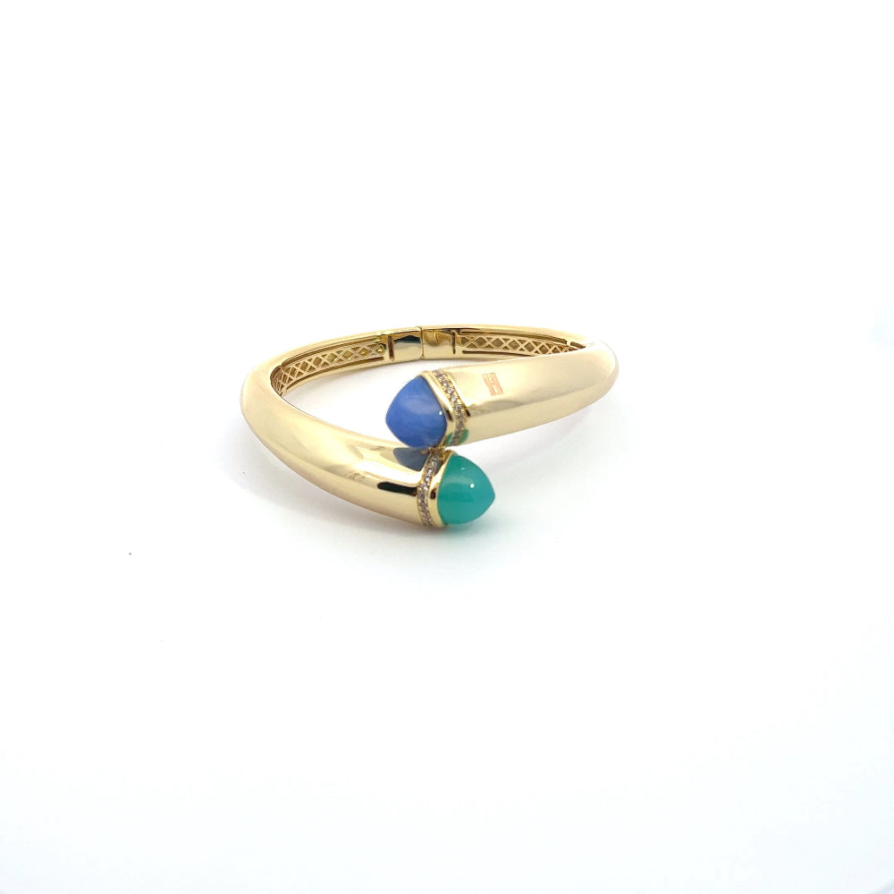 Elegant yellow gold plated cuff bracelet with colored pyramidal crystals and sparkling pavé cubic zirconia accents. Perfect for luxe everyday styling. Shop premium jewelry online.
