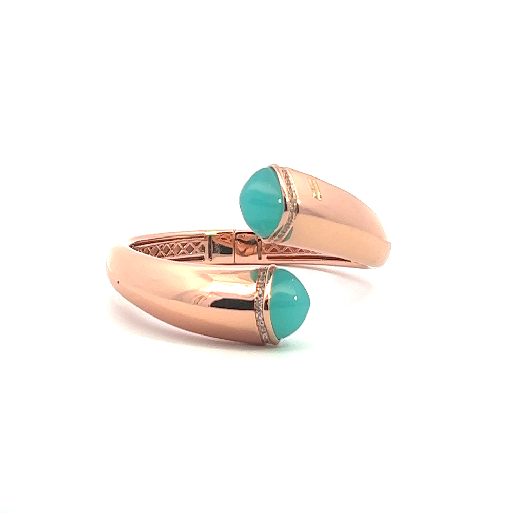 Elegant rose gold plated cuff bracelet with colored pyramidal crystals and pavé cubic zirconia accents. A chic luxe accessory for every occasion. Shop premium jewelry online.