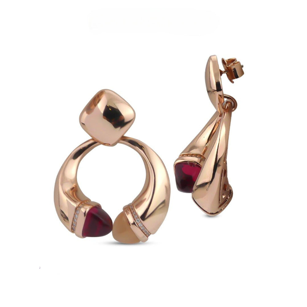 Shop online premium rose gold plated spring earrings with pyramidal crystals and pave cubic zirconia base for elegant modern styling.