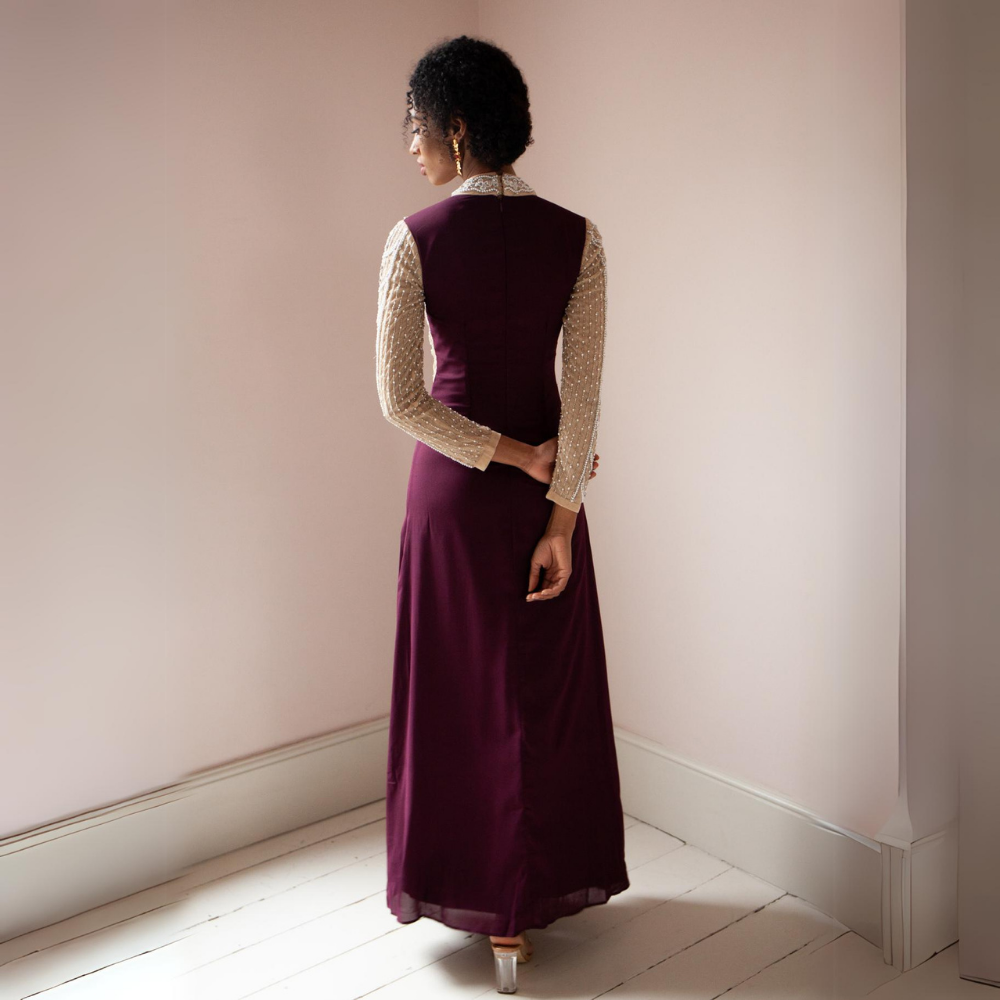 The Miley Gown features a high neckline with sheer v detail.