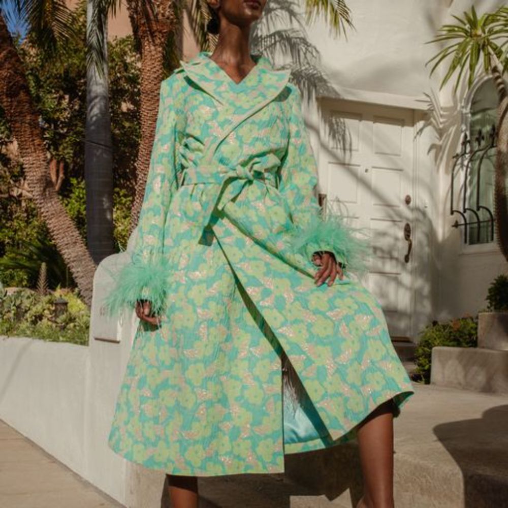 Signature Mint Jacqueline Coat With Detachable Feather Cuffs has printed fabric with an epaulette details. 