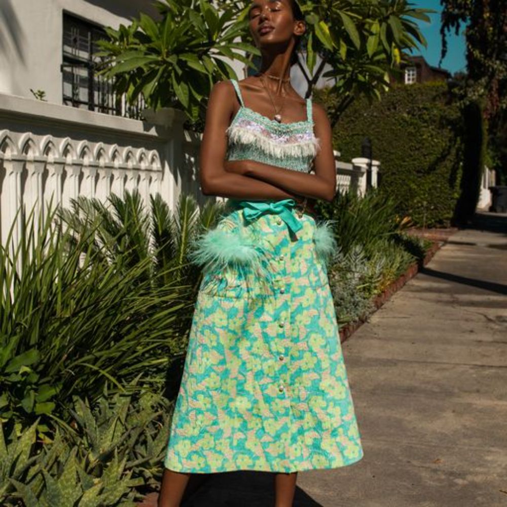 Mint Skirt With Feather Details is cut from a lightweight cotton with a hint of stretch.