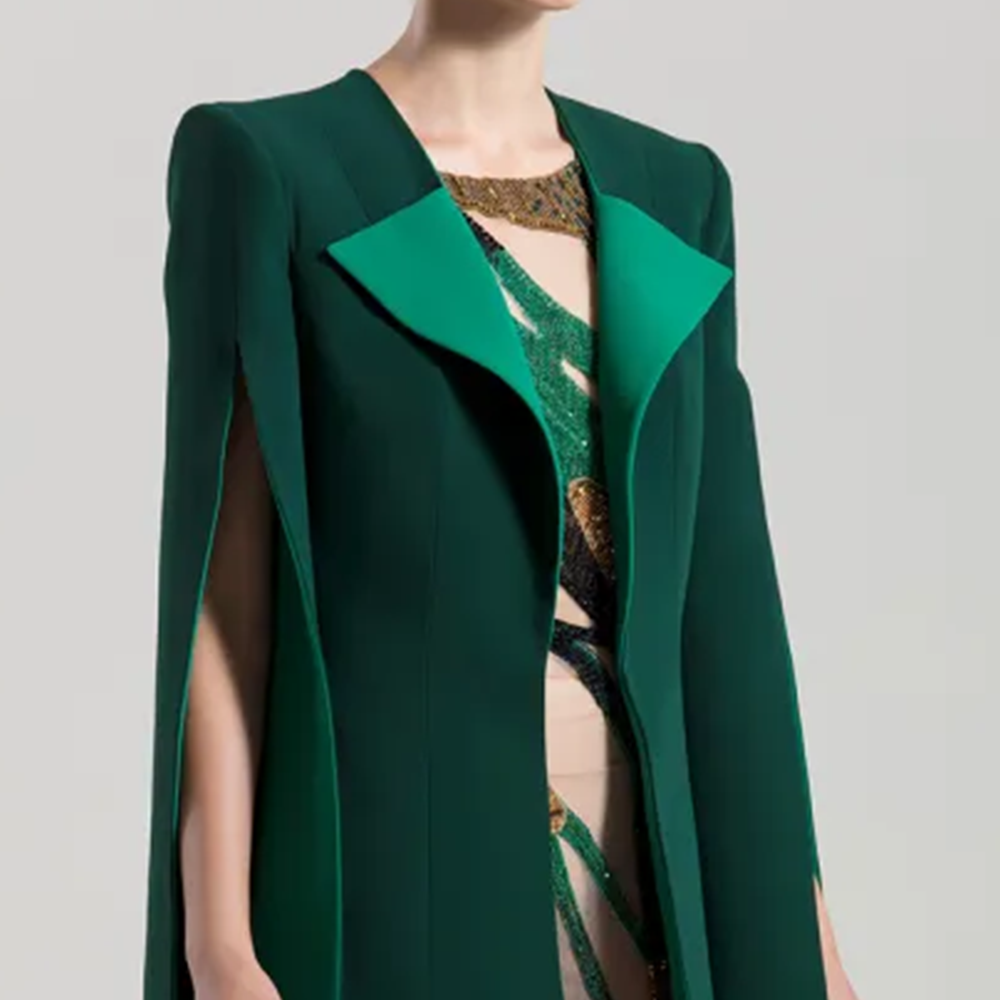 Fully beaded tulle sleeveless tight short dress, with a crepe cape jacket.