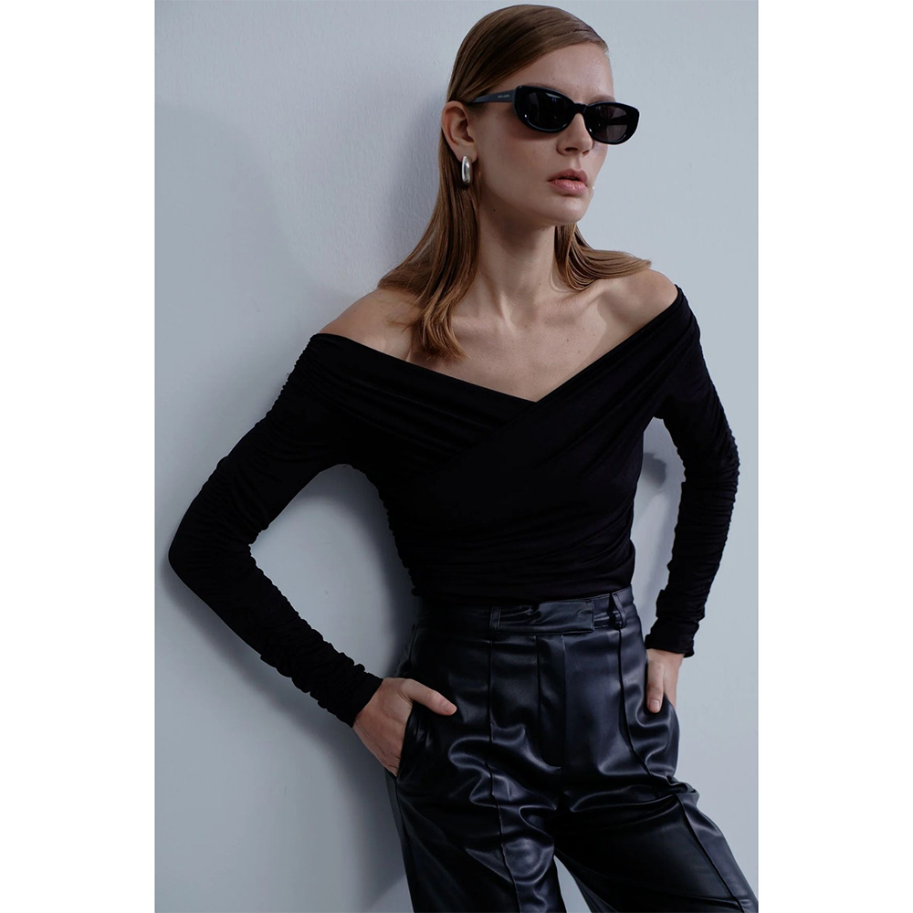 Monique Draped Jersey Blouse in Noire exudes luxury designer dress elegance. Shop Now!