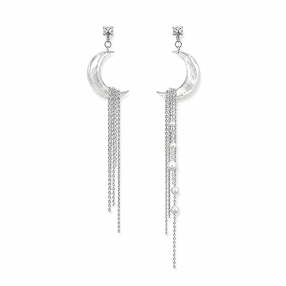 Discover the Moon Cascade Mother-of-Pearl Earrings at The Luxe Maison, featuring luminous crescent moons carved from natural mother-of-pearl, delicate silver chains, and radiant pearls in an elegant asymmetrical design. Inspired by moonlight and starlit skies, these lightweight statement earrings add a touch of celestial romance to everyday looks and special occasions.