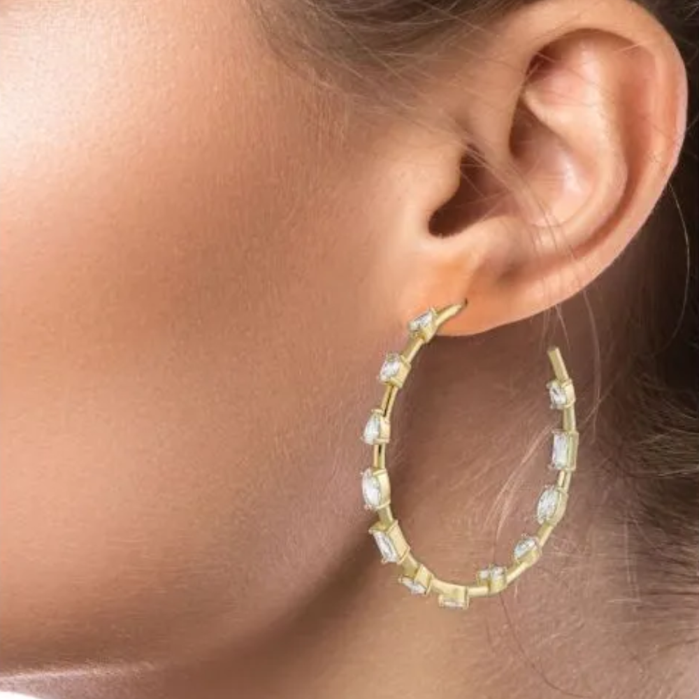 4 CTTW Multi shape cubic zirconia hoop earrings. Earrings set in 18k gold plated brass.