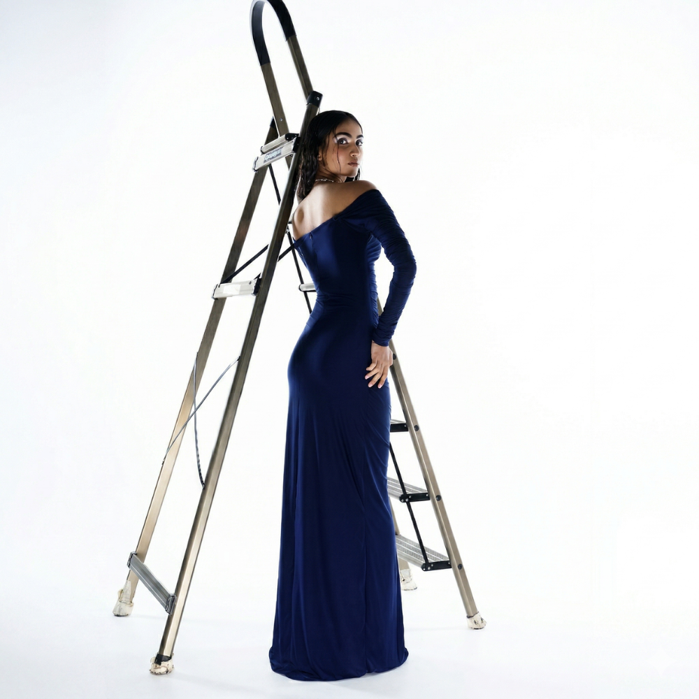 Royal blue off shoulder dress with knot detail and pleats, perfect for parties and weddings. Shop online from our exclusive collection of premium styles.