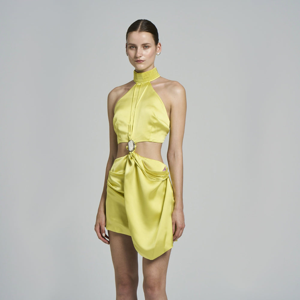 Evening mini dress. .Natural stone detail .Handwork Detailed .Wrap closure .Sleeveless .Draped .Cut-out detail .Satin fabric .Halter collar