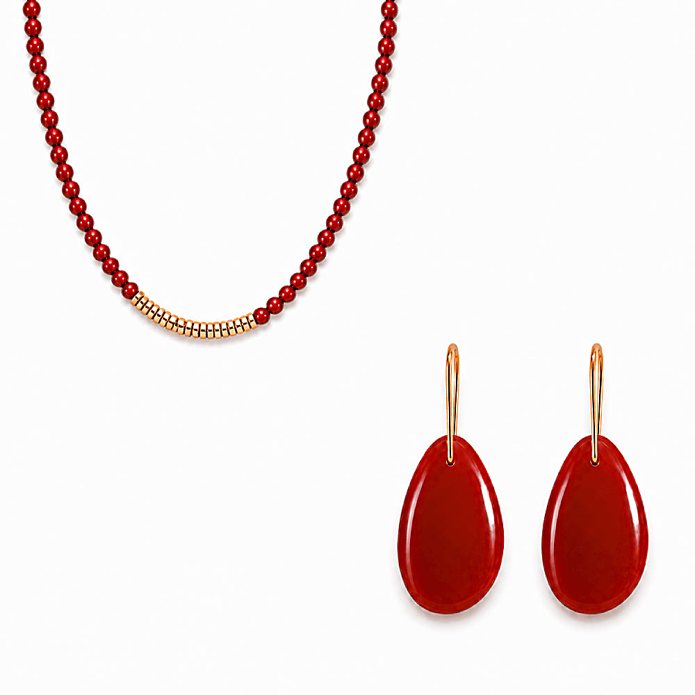 Discover the Navajo Carnelian Gold Vermeil Earrings & Necklace Jewelry Set at The Luxe Maison, featuring deep crimson agate beads and golden accents inspired by artisan craftsmanship and the beauty of natural stones. Combining earthy warmth with radiant elegance, this versatile jewelry set adds a timeless touch of color to any look. Wear the necklace and earrings together for a coordinated statement or separately for effortless everyday styling.