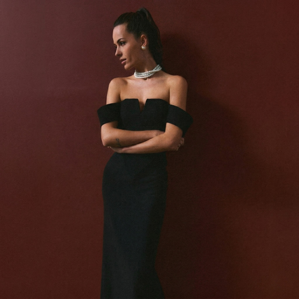 Elegant full-length corset dress featuring a stylish shoulder accent for a bold, refined look. Shop now at our exclusive clothing website.