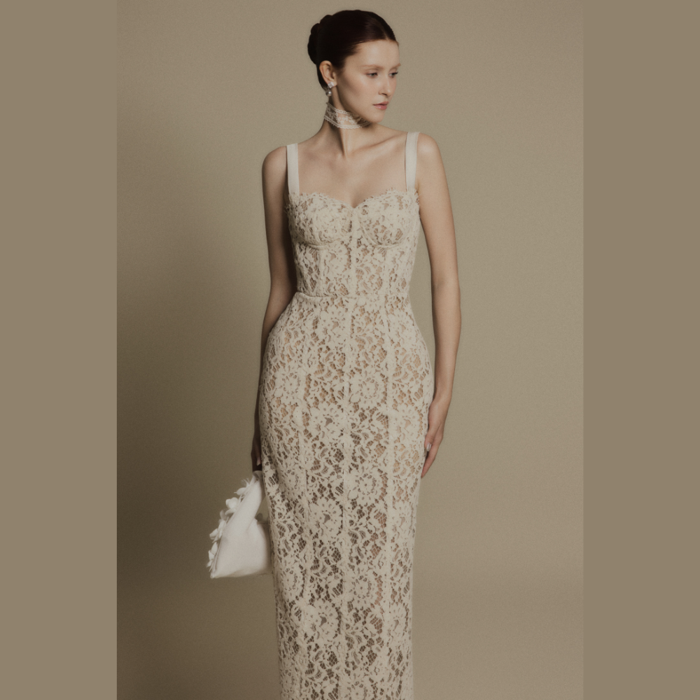 Explore our clothing shop online for the refined and stylish Noir Waist Ivory Lace Dress. Shop Now!