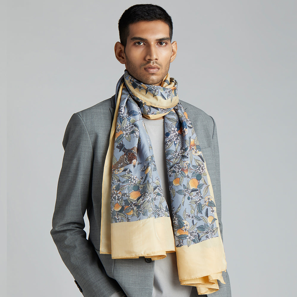A stonewashed blue stole with orange blossoms and fruit delicately hand-illustrated, and sparrows hidden under the stems.