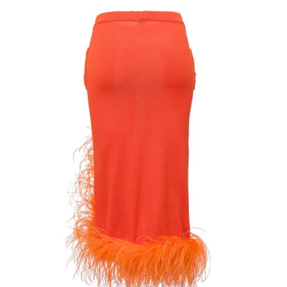 Orange Knit Skirt With Feather Details is cut from a lightweight high quality knit with a hint of stretch. 