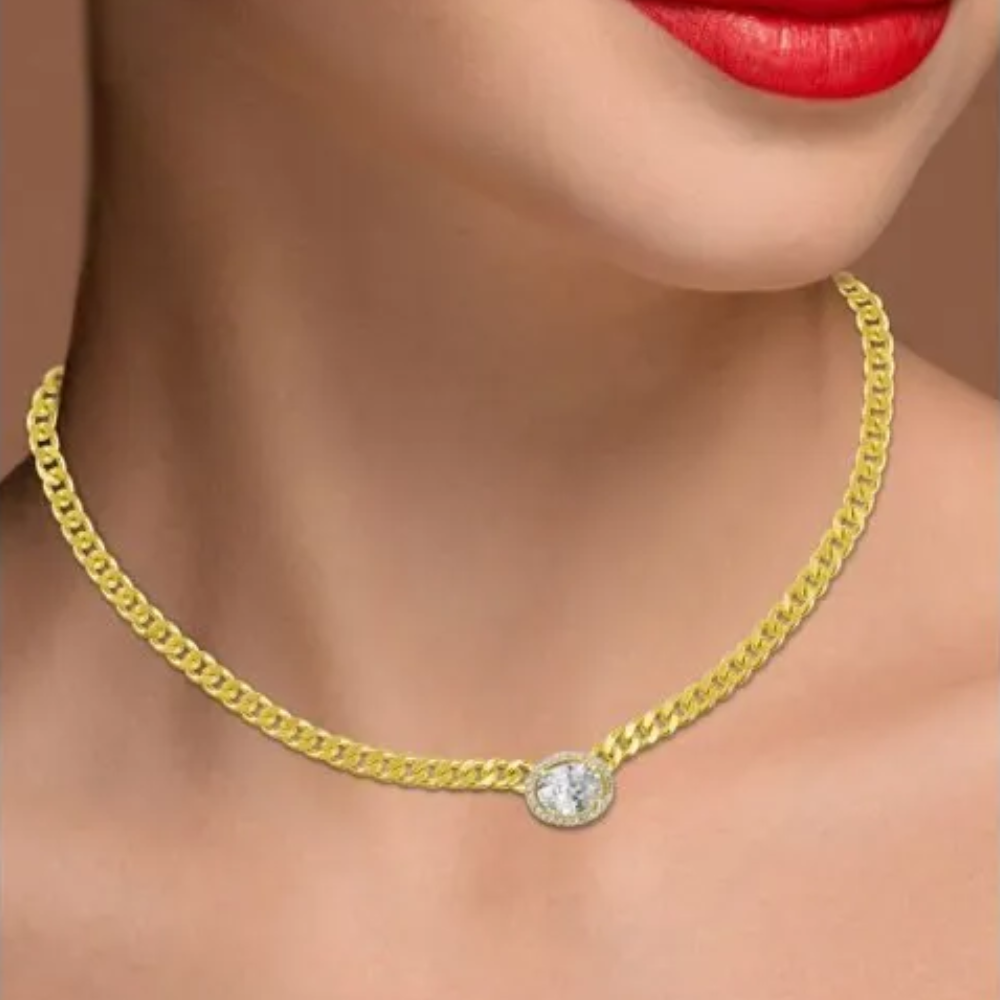2CTTW Oval Cubic Zirconia with pave trim curb chain necklace. Lobster clasp closure. Set in 18k Gold plated brass.