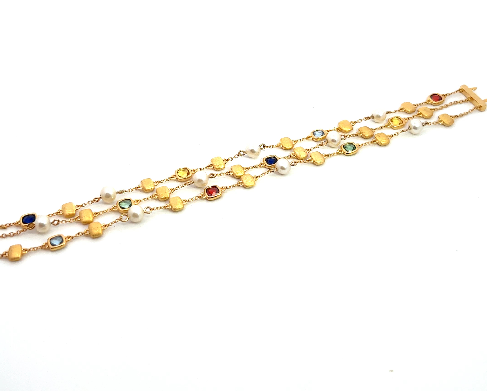 Sterling silver 18k gold-dipped bracelet with freshwater pearls, blue spinel, garnet CZ, citrine, and blue and green sapphire stones for a vibrant contemporary style. Shop premium jewelry online.
