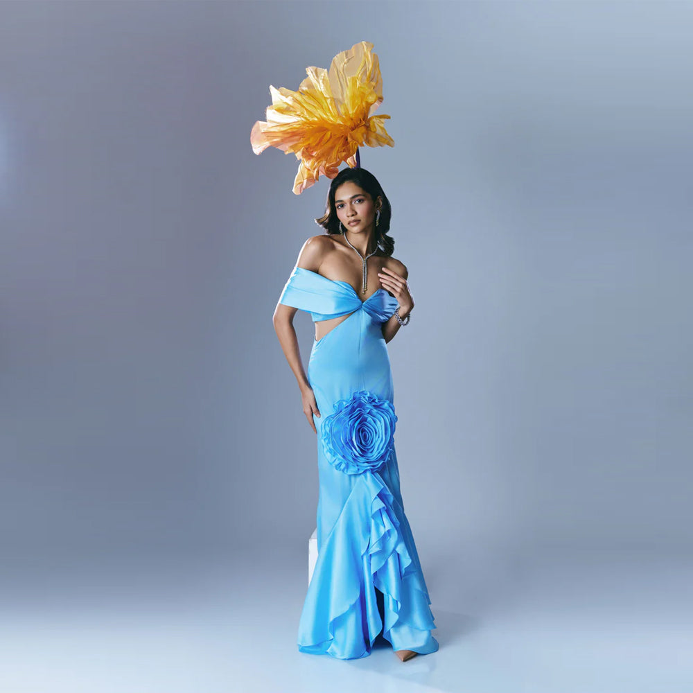 Sky blue off shoulder gown with waist cutout and ruffles, perfect for weddings. Shop online from our exclusive collection of premium styles.