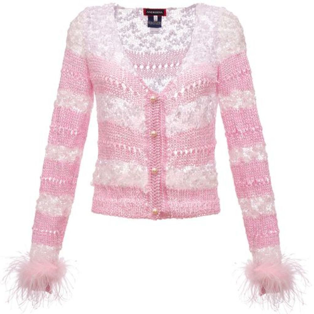 Pink Handmade Knit Sweater with long sleeves has buttons on the frond and V neck. It looks like a piece of art. 