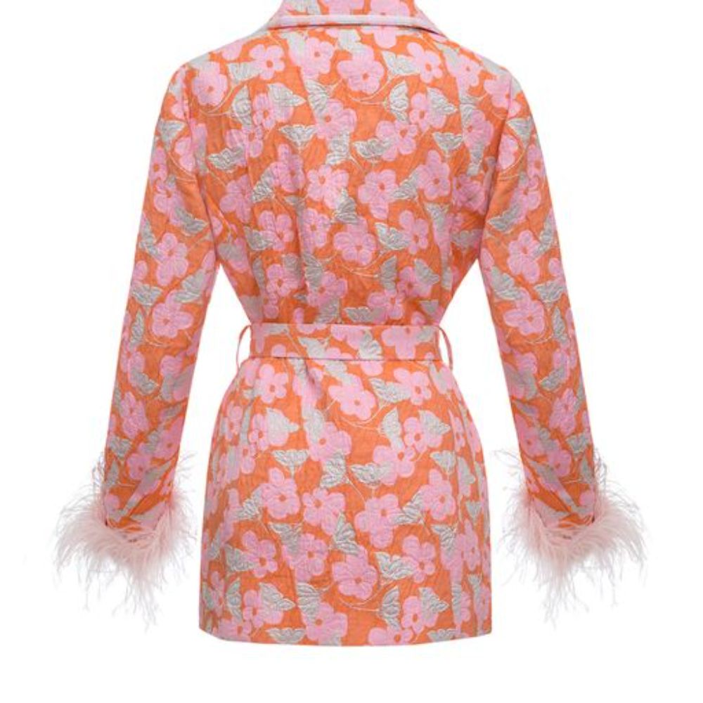 Jacquard pink jacket has belted waist, decorated with detachable feathers cuffs and an epaulet detail.