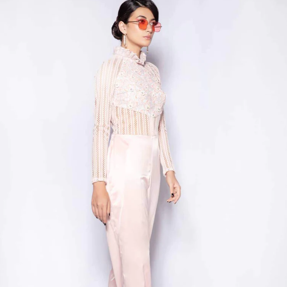 This cross-genre blouse is constructed from a combination of imported laces, stitched and appliqued together