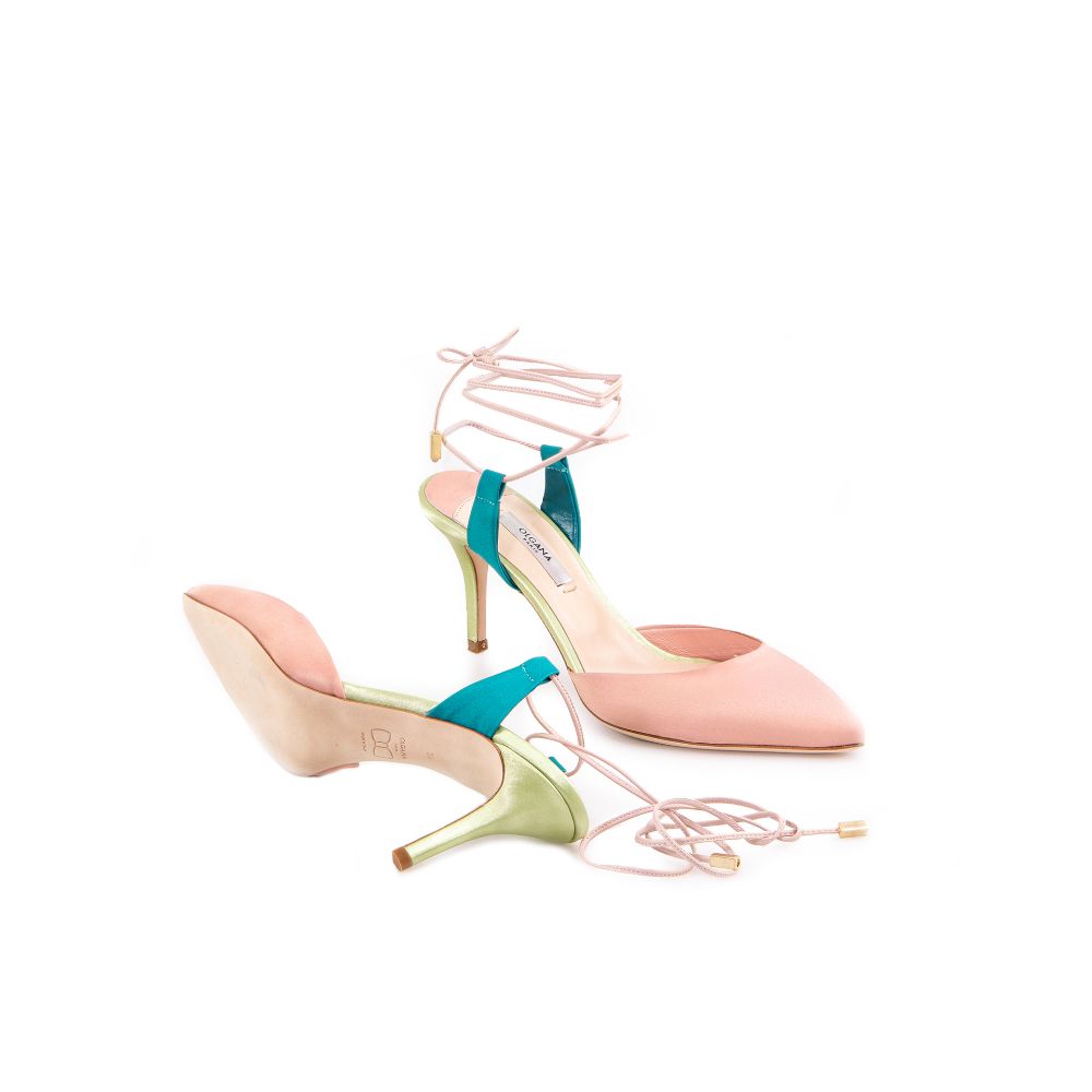 An elegant mid-heel pump in nude satin designed to instantly elevate your look. 